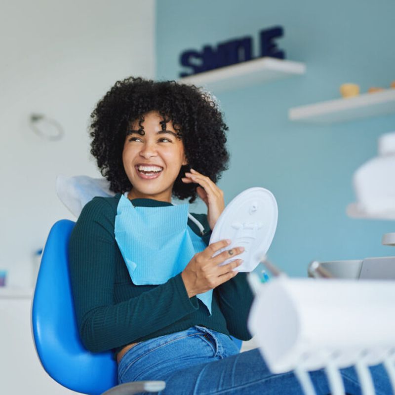 Smiling patient at the dentist's office.